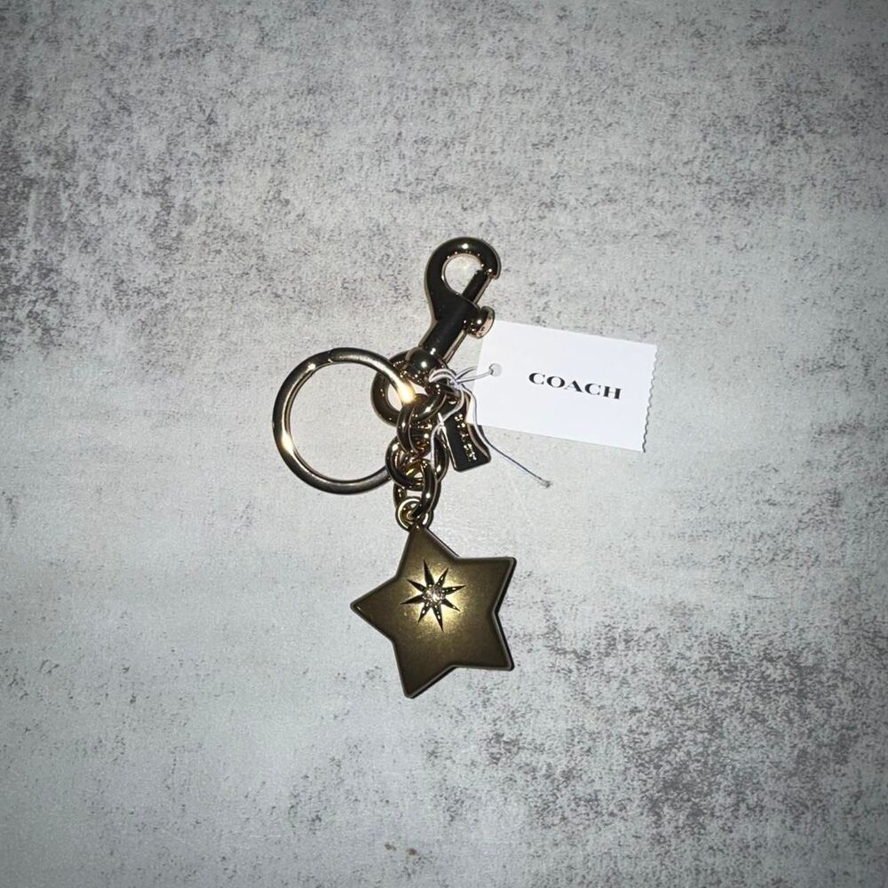 Coach gold star keychain